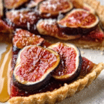 Sliced figs on pie dough for fresh fig and honey tart