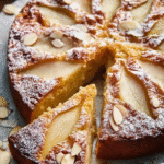 pear and almond cake freshly baked on wooden table