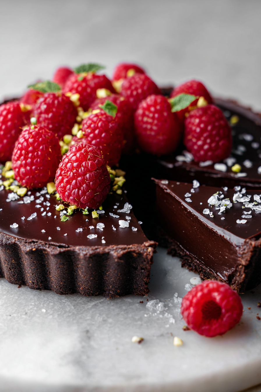 Dark chocolate ganache tart with raspberries