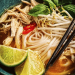 Slow Cooker Chicken Pho recipe with noodles, chicken, and herbs