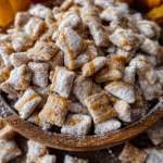 Caramel Apple Puppy Chow in a fall-themed snack mix bowl