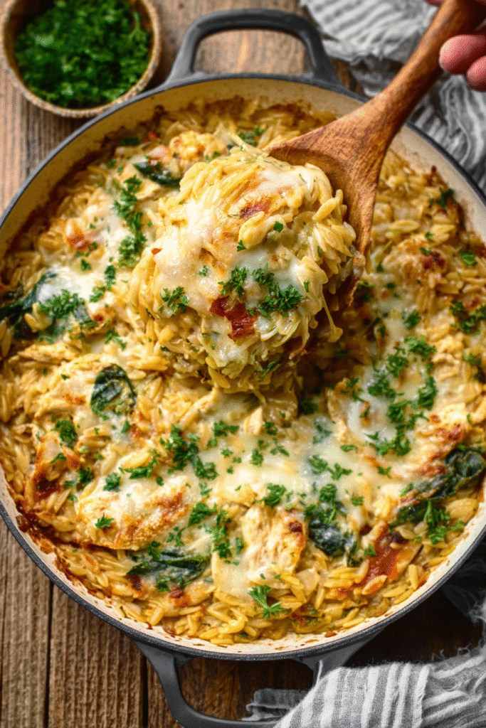 Monterey Chicken One Pan Orzo in skillet with cheese, bacon, and herbs