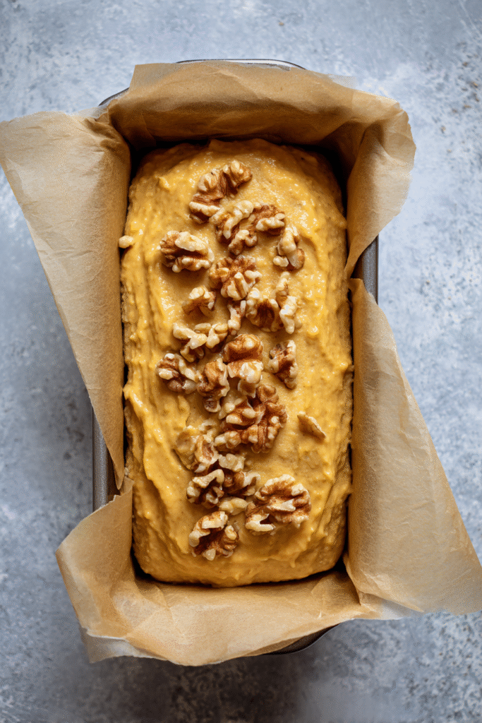 Butternut Squash Bread with Walnuts batter in loaf pan