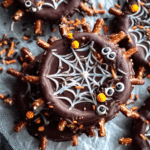 halloween chocolate pretzel spider webs on parchment