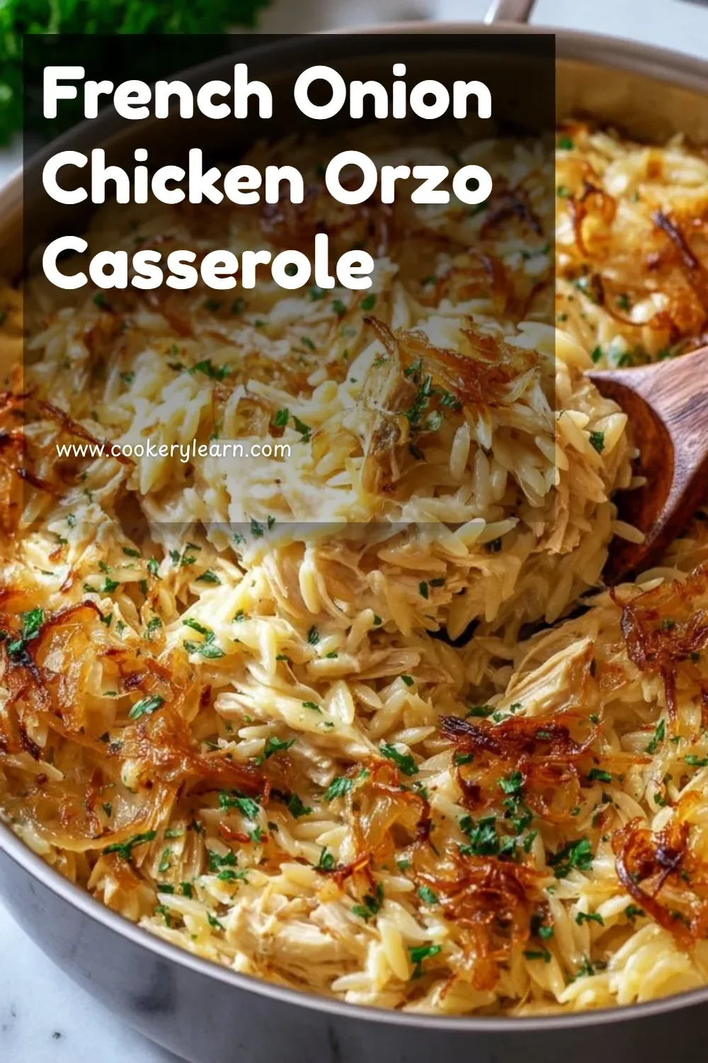 French Onion Chicken Orzo Casserole topped with melted cheese and herbs