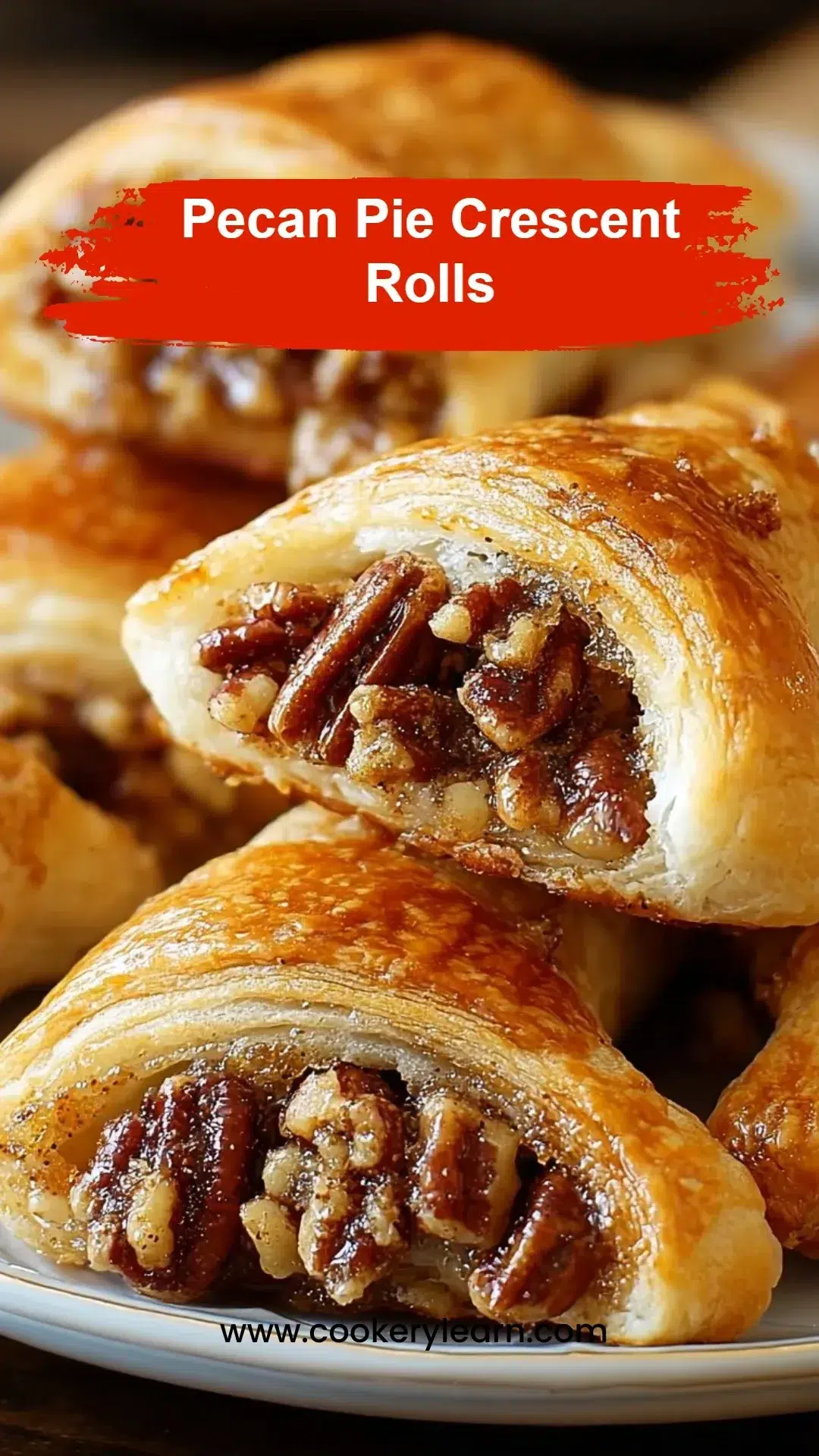 Pecan pie crescent rolls topped with caramel and pecans on a white plate