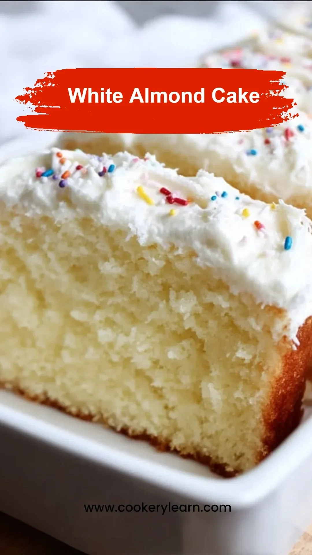 Delicious white almond cake with creamy frosting and almond decoration