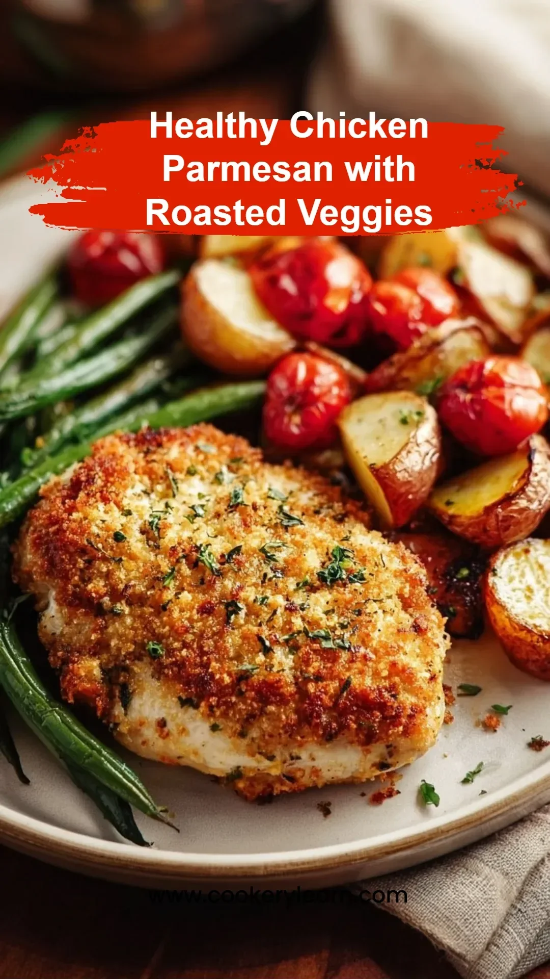 Healthy chicken parmesan served with colorful roasted veggies