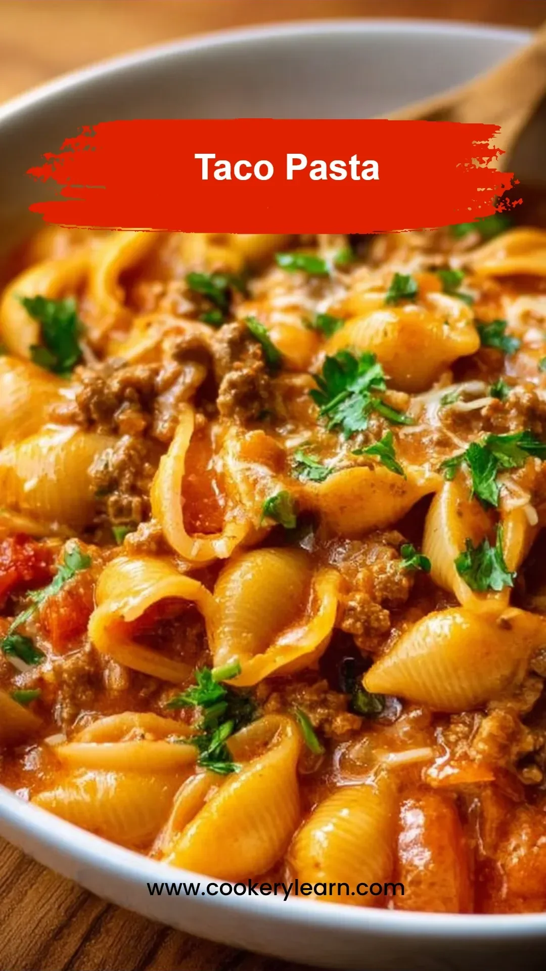 Delicious Taco Pasta dish garnished with fresh cilantro and cheese.