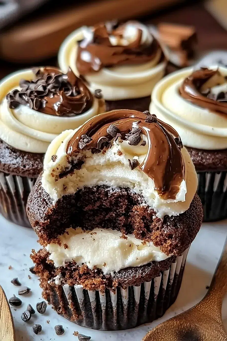 Delicious chocolate coffee cream cupcakes topped with coffee-flavored frosting.