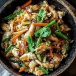 Delicious Moo Shu Chicken served with pancakes and fresh vegetables.