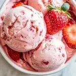 Delicious Strawberry Greek Frozen Yogurt served in a bowl with fresh berries